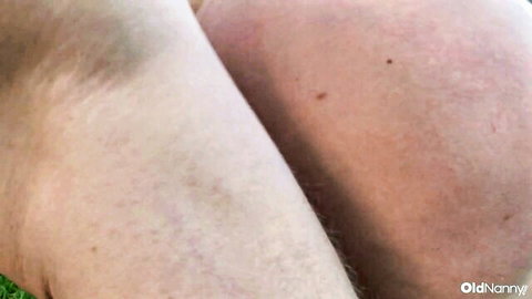 Mature blonde in reverse cowgirl, glasses on, hairy pussy visible