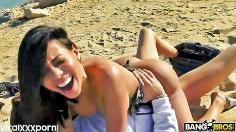 Brunette laughs joyfully on beach as guy grabs her exposed pussy and ass outdoors