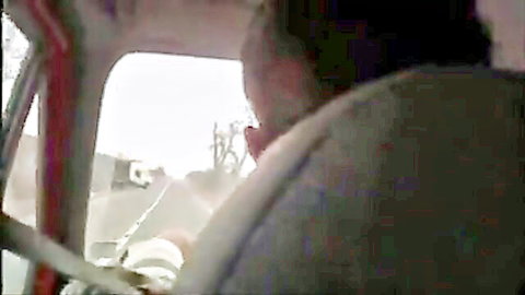 Blonde hitchhiker teasing with cleavage in rainy car pickup