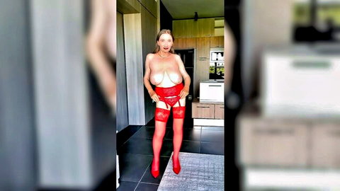 Busty mature blonde MILF in red lingerie with exposed breasts