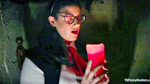 Shocked shemale nun Penny Barber holds red candle in TS Pussy Hunters