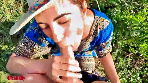 Brunette in cowboy hat gives grateful outdoor blowjob to thank helper