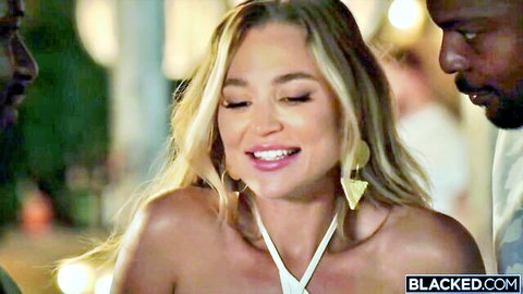 Blake Blossom smiling in white halter top during interracial BBC gangbang tease