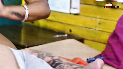Tattooed man roughly fucks curvy Indian woman doggy style bending her over table