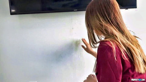 Charity Crawford reaching out in steamy scene with liquid on wall