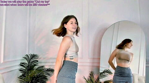 Pink Muse cute cam model dancing in crop top and skirt on Chaturbate
