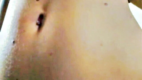 Closeup of sexy babe's smooth navel and bare belly skin in amateur solo tease