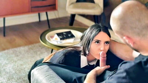 Bald man shoves thick thumb deep into brunette's wet sucking mouth on couch