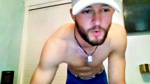 Shirtless muscular bearded man in underwear, hairy chest tease