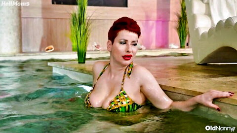 Lisa Pinelli sexy redhead milf in wet bikini by pool, teasing cleavage