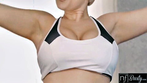 Busty blonde Angel Wicky stretching in tight white sports bra