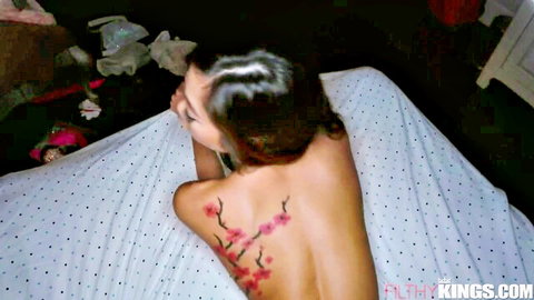 Vina Sky nude from behind with cherry blossom tattoo, seductive side pose on bed