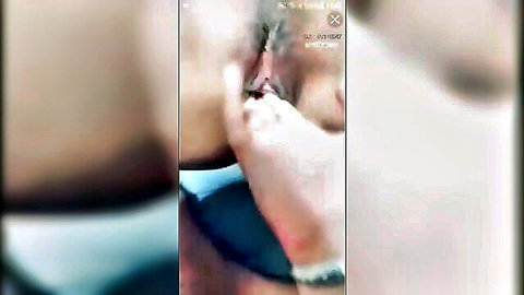 Blurry close-up of wet pussy being fingered by hand