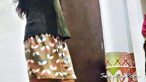 Indian woman in patterned pajama shorts, rear view tease