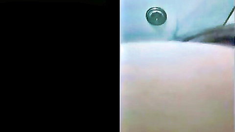 Curvy woman in foamy bathtub, teasing nude reveal