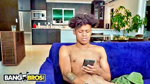 Lil D muscular black stud shirtless, eyeing phone in BangBros anal scene with Kiki Klout