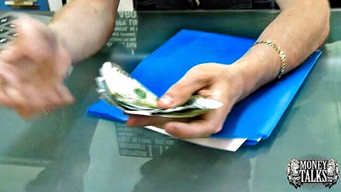 Woman's hand grabbing cash in Money Talks reality scene, teasing knees down ass up action