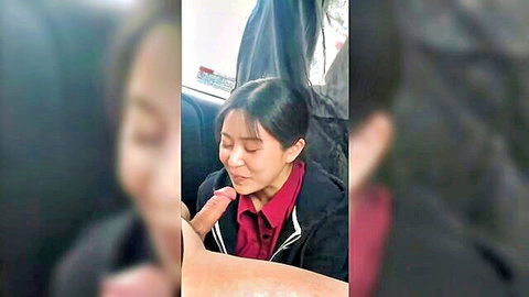 Petite Asian woman giving blowjob in car
