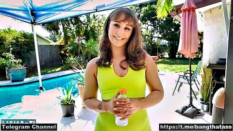 Curvy brunette in skimpy yellow top by pool, teasing mega ass for Bang Bros