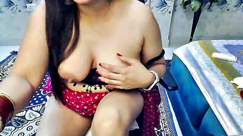 Topless Indian babe with massive tits squeezing her exposed nipples in pink floral panties