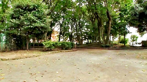 Cute Japanese girl in white dress walking in lush green park, outdoor JAV scene