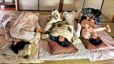 Japanese man intimately touching nude Asian woman while two others watch