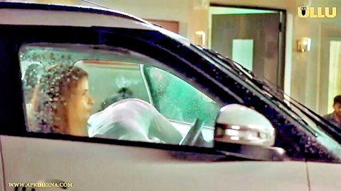 Wet South Asian babe in sheer white top sitting in rainy car with man