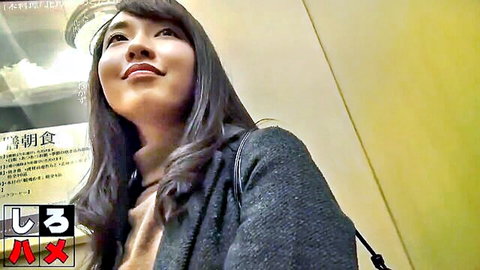 Smiling Japanese idol in elevator, long black hair, chic gray coat