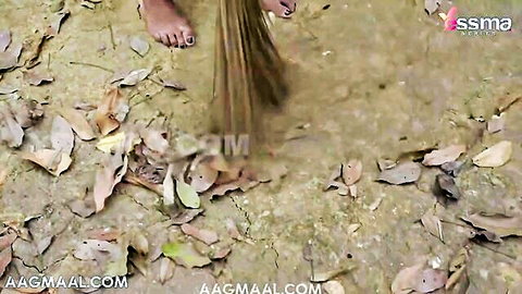 Barefoot Desi woman sweeping outdoors with visible feet and calves