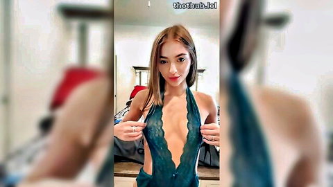 Kinsley Wyatt in revealing green lace lingerie, teasing with hands on straps