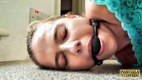 Ivey Passion ballgagged and restrained in BDSM submission scene