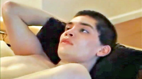 Young shirtless Latino guy lying back seductively, Rabid ready for action