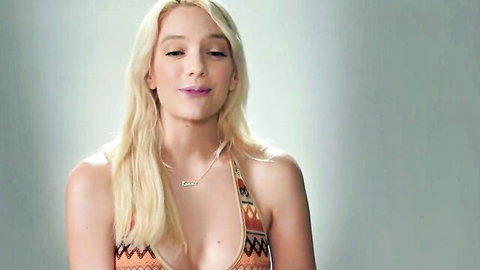 Kenna James blonde in low-cut patterned bikini top, teasing cleavage