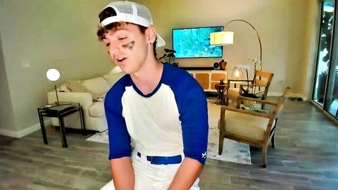 Curly-haired twink Rawr_itsben in baseball cap and jersey, gay oral tease