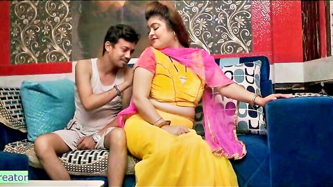 Indian BBW mommy in yellow saree teasing young man on couch