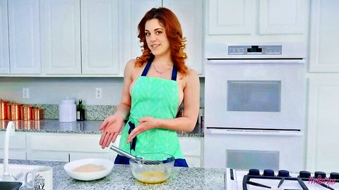 Molly Stewart in sexy green apron mixing batter in hot kitchen scene