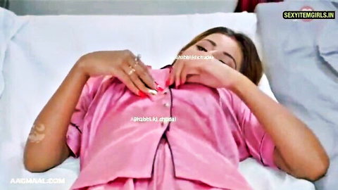 Sexy Indian bhabhi MILF alone in pink satin nightgown, seductive solo pose