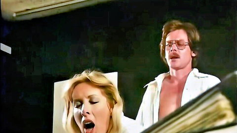 Vintage blonde bombshell giving enthusiastic blowjob to retro stud in 70s porn