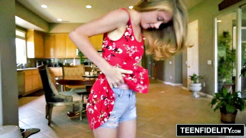 Blonde teen in floral top and tiny ripped denim shorts teases her small ass bending over in kitchen