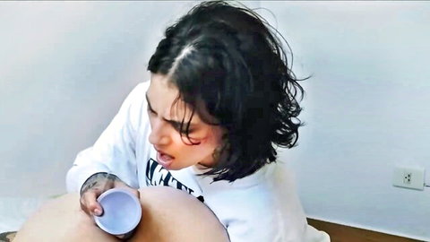 MimiPaul in verified amateur video, tattooed brunette holding cup near crotch in hoodie
