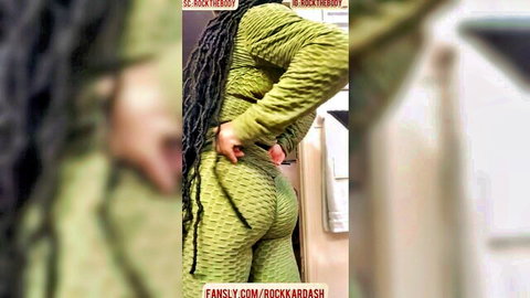 Thick ebony babe with dreads posing her huge juicy ass in tight green bodysuit