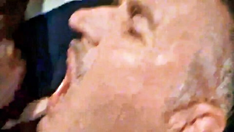 Elderly man performing close-up oral sex on woman