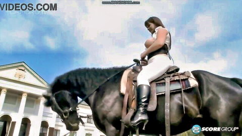Busty Terry Nova rides horseback in tight white top showing cleavage