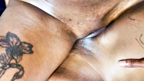 Ebony lesbians scissoring with hairy pussies grinding together and finger on clit closeup