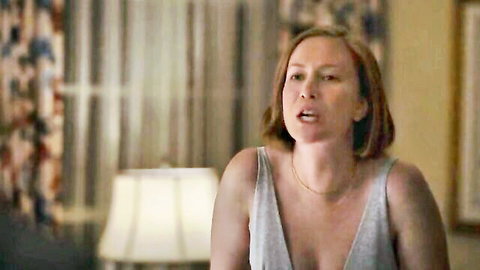 Christina Hendricks in low-cut tank top showing cleavage from Hacks S03E06