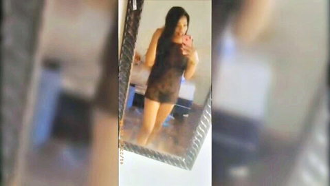 Sexy Asian woman in sheer black lingerie exposing perky tits in mirror selfie