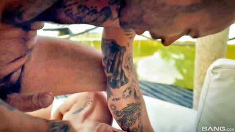 Tattooed muscular man passionately fucking slim tattooed woman from behind outdoors