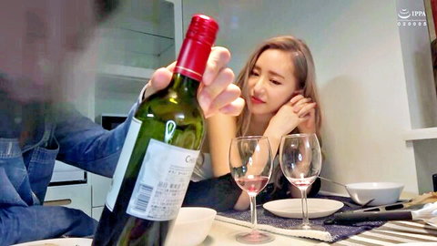 Sarina-san smiling as partner pours red wine in intimate Asian couple scene