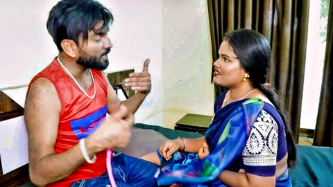 Sexy Indian woman in blue saree chats intimately with muscular guy on bed