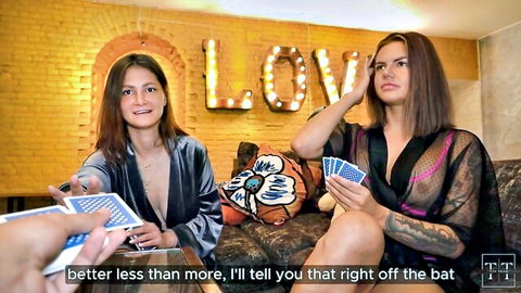 Two brunettes in sheer lingerie and robe play cards, loser gets intimate in hot game